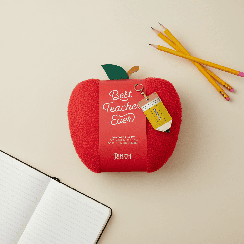 Apple-shaped pillow with “Best Teacher Ever” sleeve, three pencils, and pencil keychain, ideal for personalized teacher appreciation gifts from Celebratopia.