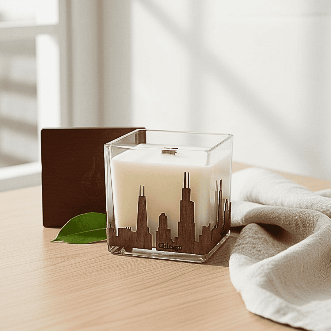 Candle with Chicago skyline design on a wooden surface