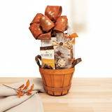 Gift basket with a wooden basket containing snacks and a decorative bow on a light background
