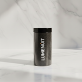 Lumenuit Colored Wax Pearls in a sleek, black speckled jar with a lid, ideal for creating customizable, vibrant candles in heat-resistant vessels.