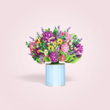 Spring Floral Pop Up Card featuring a mixed flower bouquet in a blue keepsake box, perfect for gifting; includes a blank note card.