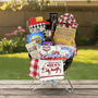 Weber Smokey Joe Portable Grill Gift featuring a grill, marshmallows, BBQ sauce, and utensils, perfect for gifting or raffles, includes essentials for a great barbecue