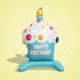 Inflatable jumbo cupcake shaped balloon with 'Happy Birthday!' text on a yellow background