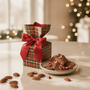 Plaid gift box with red ribbon and assorted pecan chocolates