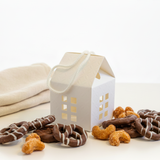 a white textured mini house gift box with sweet or savory snacks