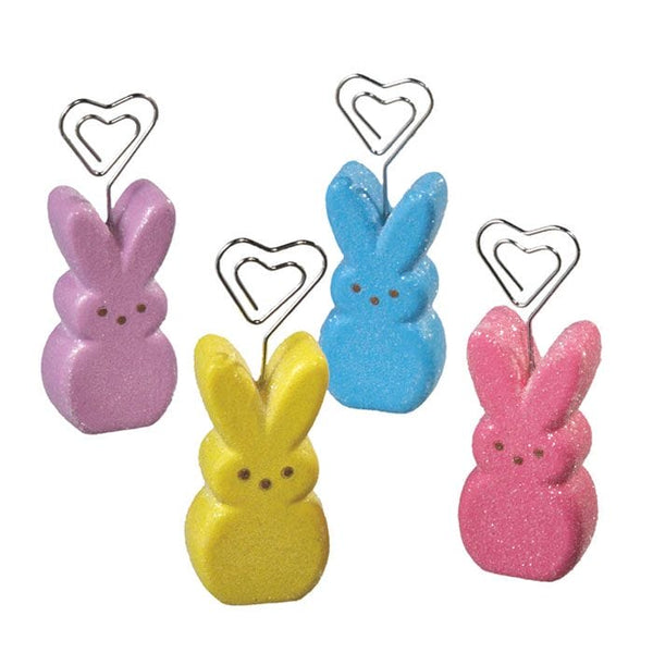 Peeps Placecard Holder Set: Four bunny figurines with heart-shaped clips, perfect for spring-themed table décor. Ideal for Celebratopia's custom gifting needs.