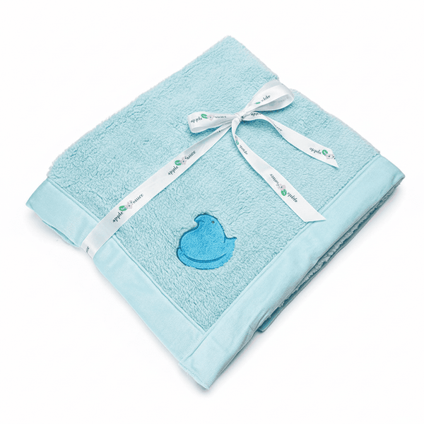 Peeps Chick Whisper Baby Blanket - Blue, folded with white ribbon, features a plush exterior, velvet interior, and embroidered blue duck silhouette, perfect for gifting.