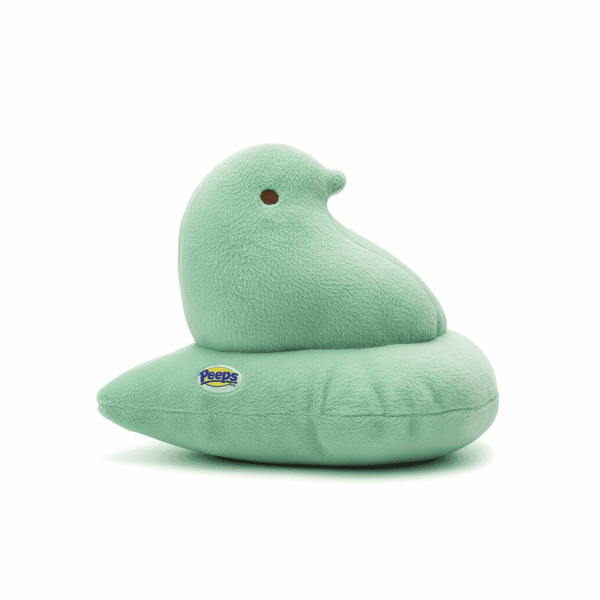 Peeps Plush Chick - 9 Green, Blue Tag: A soft, mint-green plush pillow shaped like a Peeps chick, featuring the Peeps logo tag and embedded emblem.