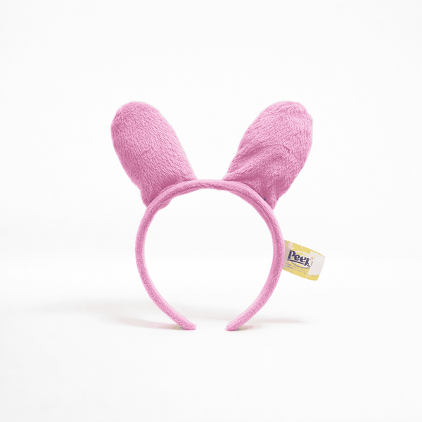 Peeps Bunny Ears - Pink: Plush headband with soft, stuffed ears, featuring a Peek! tag, perfect for Celebratopia's personalized gifting experience.