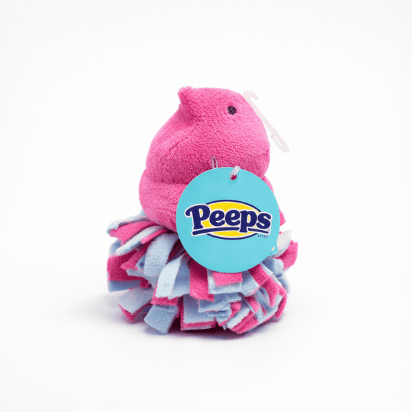 Peeps Pink Chick Squeaky Fleece Dog Toy with a tufted skirt and attached blue hang tag, ideal for novelty gifting.