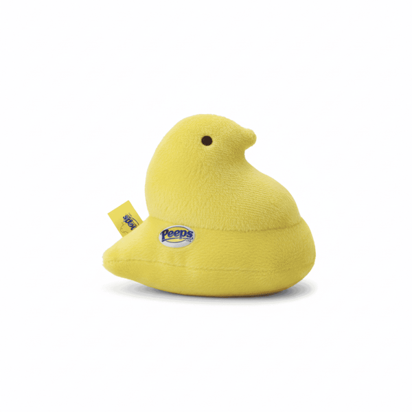 Peeps Plush Chick - 5 Yellow, Blue Tag: Bright yellow plush toy in classic chick shape with Peeps logo, including hard plastic emblem, representing Celebratopia's playful gifting style.